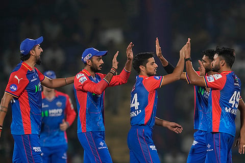Mukesh Kumar, right, celebrates wicket of Nicholas Pooran 